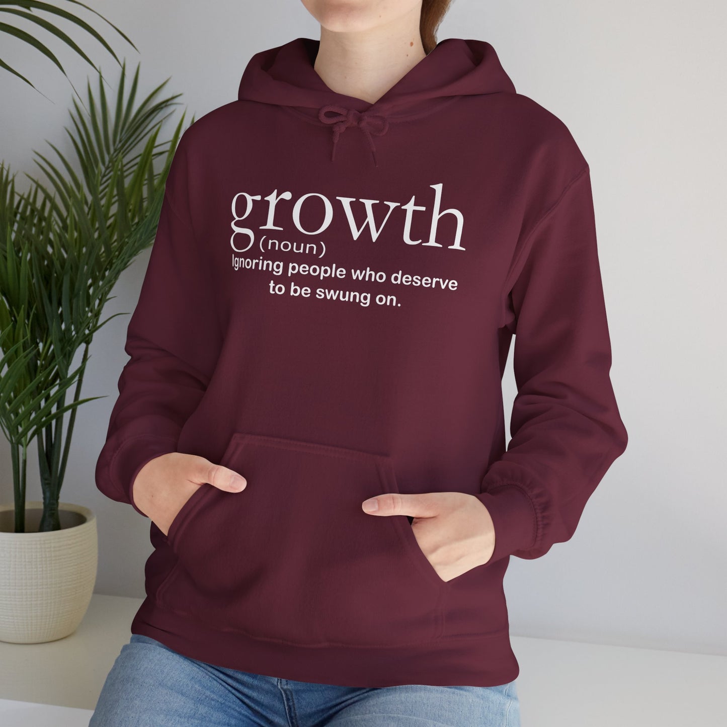 Hoodie — "growth (noun) Ignoring people who deserve to be swung on." Motivational Black Pullover