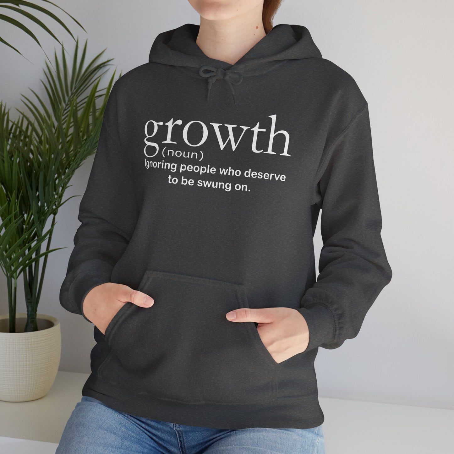 Hoodie — "growth (noun) Ignoring people who deserve to be swung on." Motivational Black Pullover